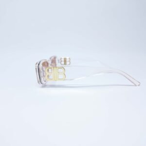 Gafas de sol transparentes con detalle dorado